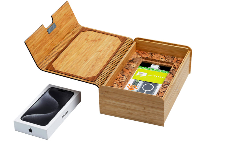 Wooden box with a phone inside on a white background